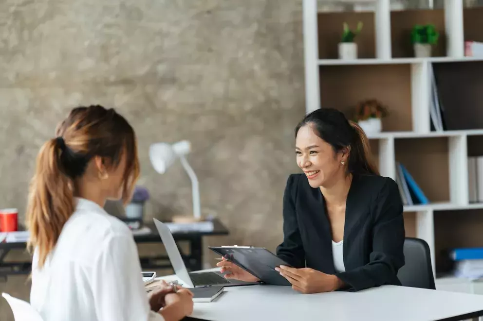 people talking at a desk people talking at a desk