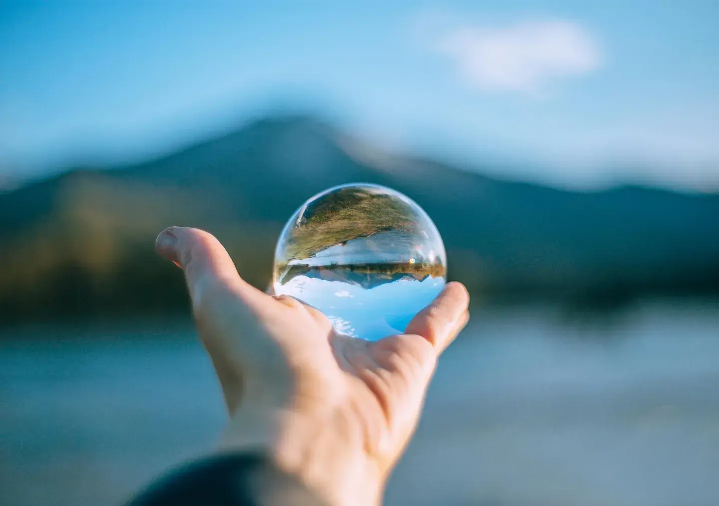 Person holding lens ball Person holding lens ball